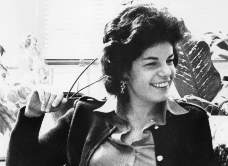 A black and white photo of Susan Stamberg smiling.