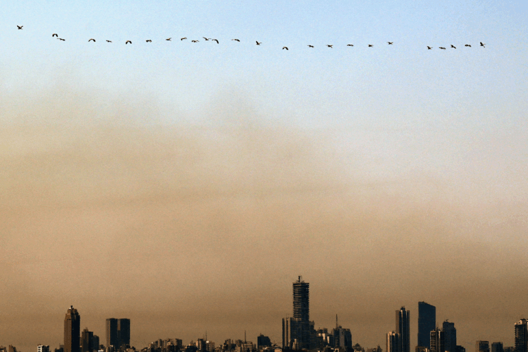 A cloud of smog hovers above Lebanon's capital Beirut on August 14, 2025. Air pollution from diesel generators and smokey tailpipes are among the reasons that cancer is surging in Lebanon.