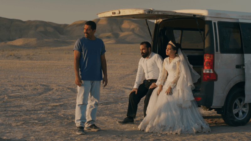 https://wbhm.org/wp-content/uploads/2025/10/mohamad-ali-elyasmehr-majid-panahi-and-hadis-pakbaten-in-it-was-just-an-accident-courtesy-of-neon-800x450.png