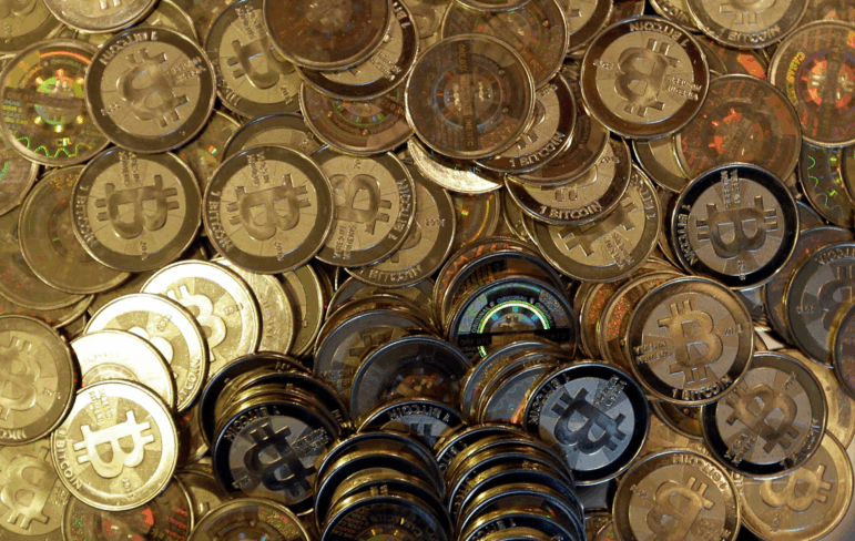 This file photo shows bitcoin tokens in Sandy, Utah.