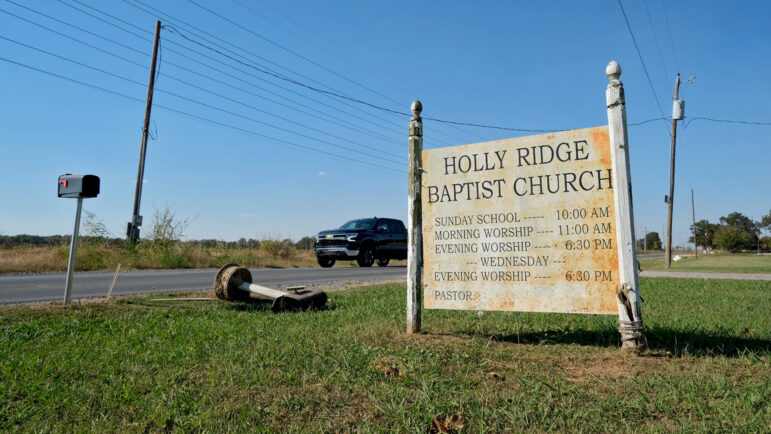 A mailbox lies on the ground in front of Holly Ridge Baptist Church on Thursday, October 16, 2025, in Holly Ridge, Louisiana.