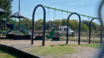 An 18-wheeler drives by the playground at Holly Ridge Elementary School in Holly Ridge, Louisiana, on Friday, October 17, 2025.