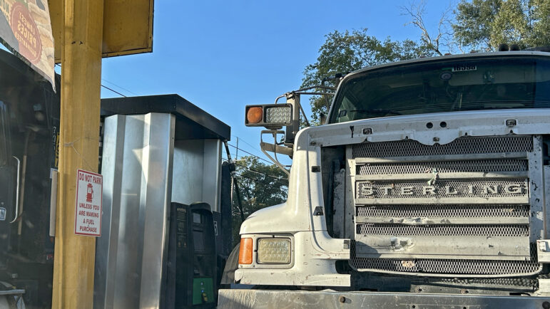 A pair of dump trucks at a gas pump in Delhi, Louisiana, on Thursday, October 16, 2025.
