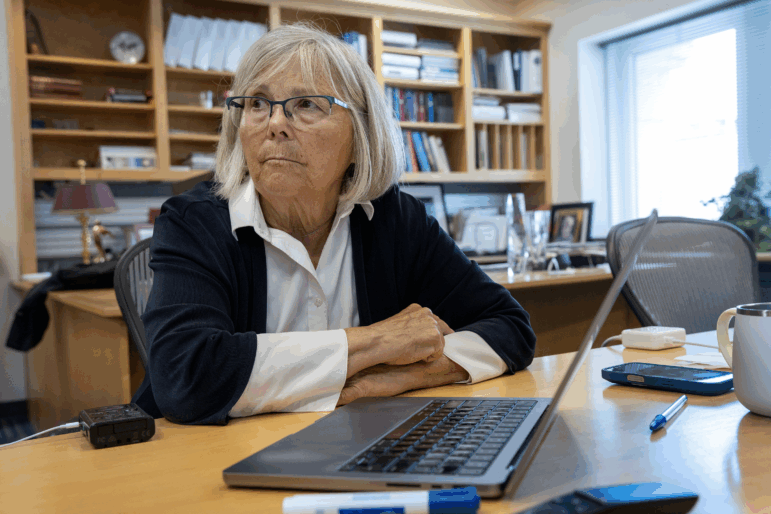 Joan Brugge sits in her office at Harvard Medical School.