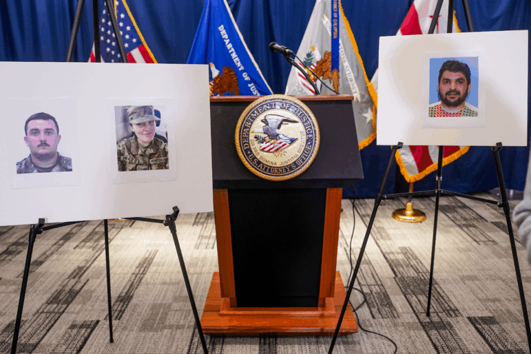 Pictures of National Guard members Andrew Wolfe and Sarah Beckstrom, who were shot on November 26 in Washington, are displayed next to a picture of the suspect of the shooting, Afghan national Rahmanullah Lakanwal, on the day of a press conference with FBI Director Kash Patel, U.S. Attorney for D.C. Jeanine Pirro and other authorities, in Washington, D.C., U.S., November 27, 2025.