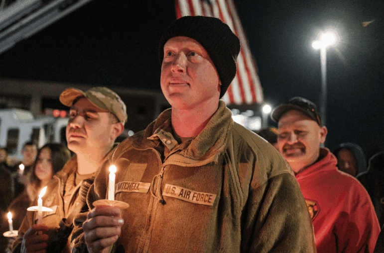 SSgt Jason Mitchell, a member of the West Virginia Air National Guard, attends a candlelight vigil for SSgt Andrew Wolfe outside of the Berkley County Sheriff Office on December 3, 2025 in Martinsburg, West Virginia. SSgt Andrew Wolfe was shot on November 26 near The White House in what officials described as a targeted attack by an Afghan refugee who had previously worked with the United States military and C.I.A in Afghanistan.