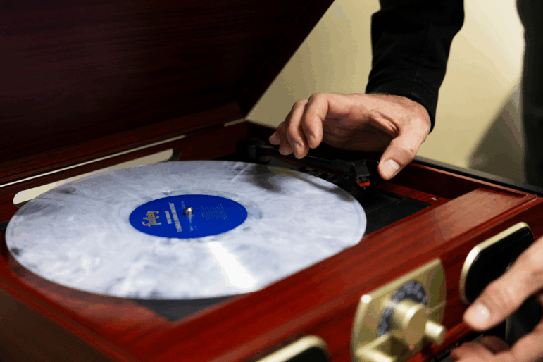 Dr. Tyler Jorgensen, a palliative care doctor at Dell Seton Medical Center, beings to play a Charlie Brown Christmas album in an office on December 9, 2025. Ferguson said this album is popular due to the lack of lyrics, which makes for easier listening.