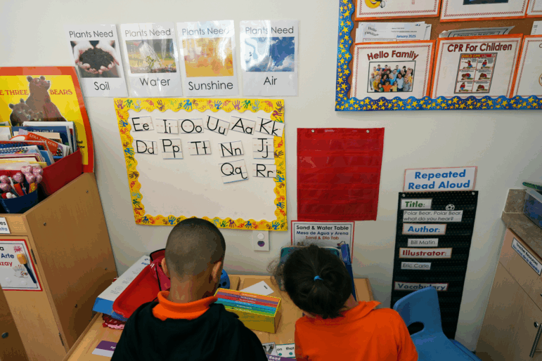 Students help put away supplies at the end of a reading and writing lesson at a Head Start program in Miami in January 2025.