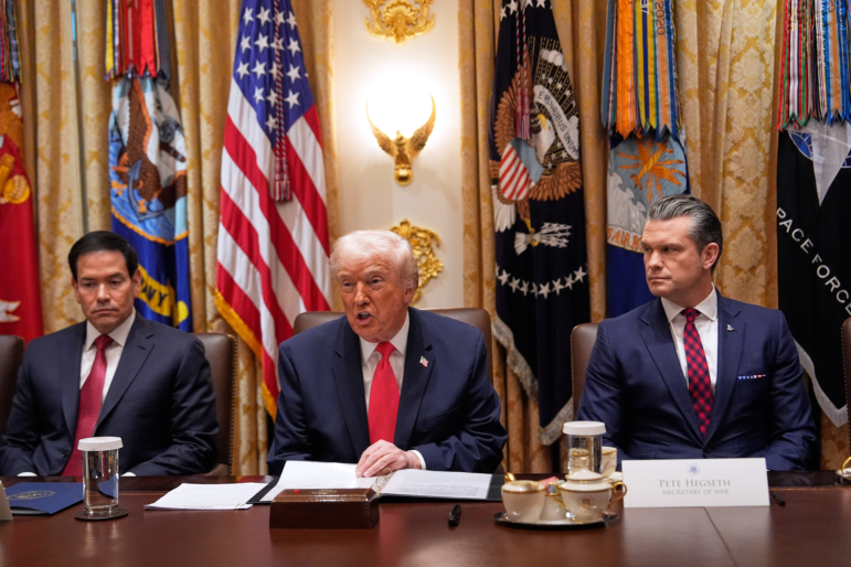 President Trump speaks during a Cabinet meeting at the White House, Tuesday, in Washington, as Secretary of State Marco Rubio (left) and Defense Secretary Pete Hegseth look on. (AP Photo/Julia Demaree Nikhinson)