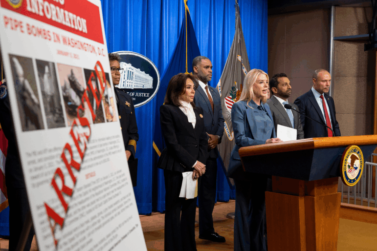 Attorney General Pam Bondi, third from right, Washington Metropolitan Police Chief Pamela Smith, left, U.S. Attorney Jeanine Pirro, ATF Special Agent in Charge of Washington Anthony Spotswood, FBI Director Kash Patel, and FBI deputy director Dan Bongino speak during a news conference at the Department of Justice, Thursday, Dec. 4, 2025, in Washington.