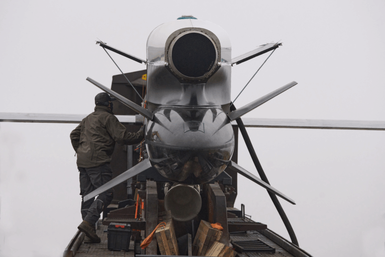 Workers and military inspect Ukrainian Fire Point's Flamingo missiles during handover to the military in an undisclosed location in Ukraine Thursday, Dec. 4, 2025.