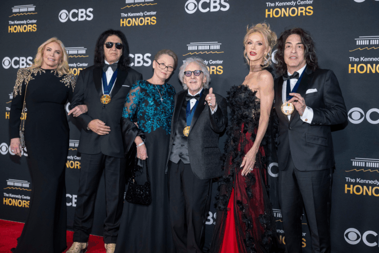From left, Shannon Tweed Simmons, 2025 Kennedy Center Honoree and member of rock band KISS Gene Simmons, Gigi Criss, 2025 Kennedy Center Honoree and member of rock band KISS Peter Criss, Erin Stanley and 2025 Kennedy Center Honoree and member of rock band KISS Paul Stanley pose on the red carpet for the 48th Kennedy Center Honors at the Kennedy Center for the Performing Arts.