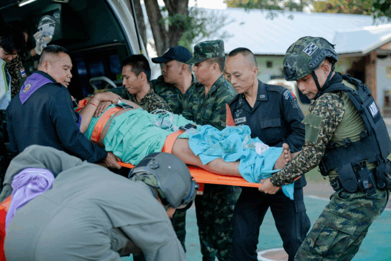 In this photo released by Royal Thai Army, a wounded Thai soldier is carried to be transferred to a hospital in Sisaket province, Thailand, Sunday, Dec. 7, 2025, after, according to a Thai army spokesperson, Cambodian troops fired into Thai territory.