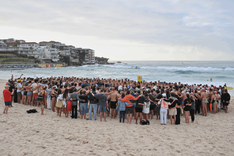 Swimmers gather for a morning vigil in Sydney, Wednesday, Dec. 17, 2025, following Sunday's shooting at Bondi Beach.