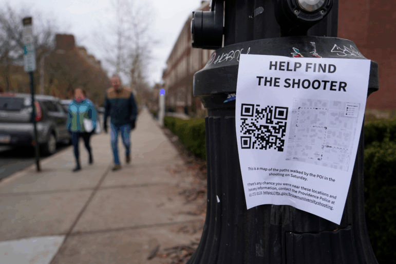 A poster seeking information about the campus shooting suspect is seen on the campus of Brown University on Dec. 17, 2025, in Providence, R.I.