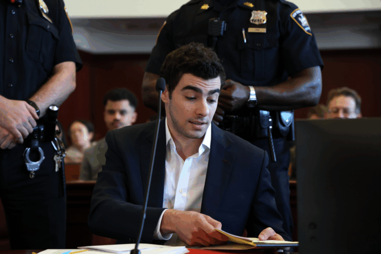 Luigi Mangione appears in Manhattan Criminal Court for an evidence hearing, Thursday , Dec. 18, 2025, in New York.