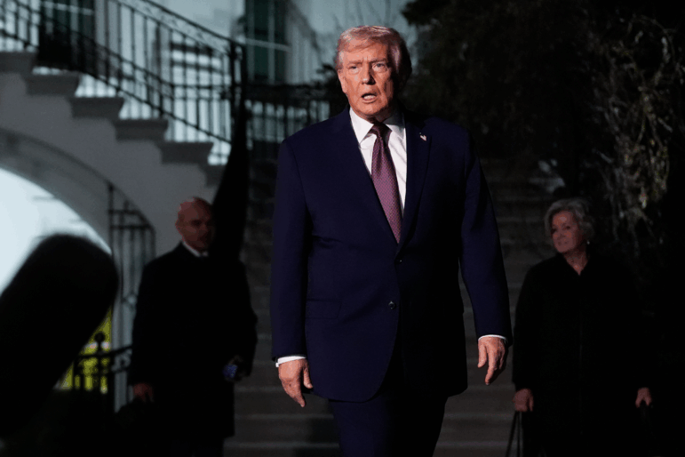President Trump walks to speak with reporters while departing the White House on Friday.