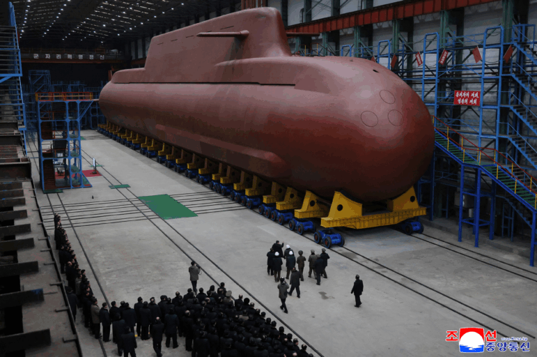 In this undated photo provided Thursday, Dec. 25, 2025, by the North Korean government, its leader Kim Jong Un inspects a nuclear-powered submarine under construction at an undisclosed location in North Korea. Independent journalists were not given access to cover the event depicted in this image distributed by the North Korean government. The content of this image is as provided and cannot be independently verified. Korean language watermark on image as provided by source reads: "KCNA" which is the abbreviation for Korean Central News Agency.