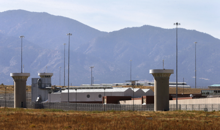 A guard tower looms over a federal prison complex which houses a Supermax facility outside Florence, Colo., in 2015.