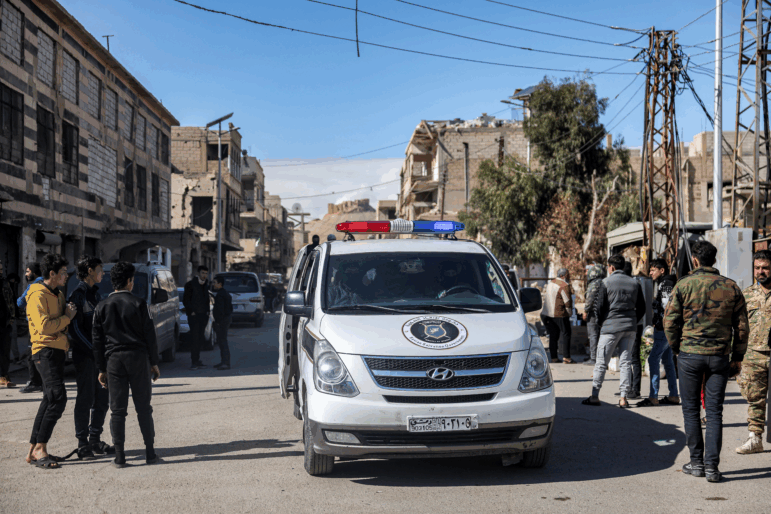 A police vehicle of the interim Syrian government moves through a street in Palmyra in central Syria on Feb. 7.