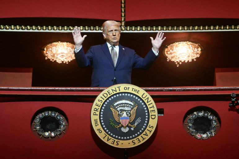 President Donald Trump stands in the presidential box at the John F. Kennedy Center for the Performing Arts in Washington, D.C.