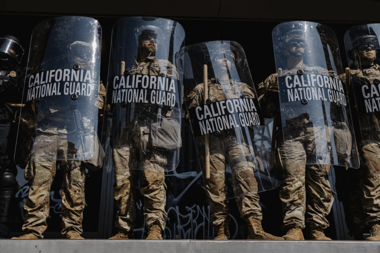 National Guardsmen stand outside of the Edward Roybal Federal Building on June 9, 2025 in Downtown Los Angeles.