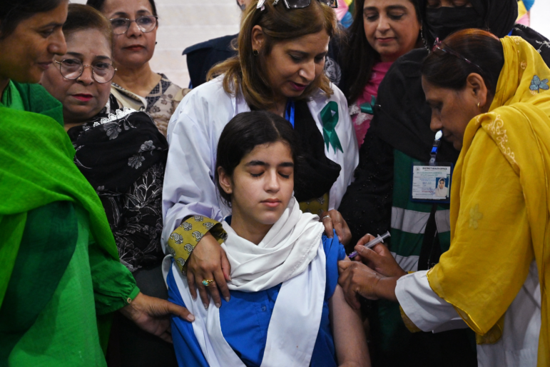 A health worker administers the human papillomavirus (HPV) vaccine to a school student in Islamabad, Pakistan on September 24, 2025, during a HPV vaccination drive against cervical cancer, most frequently diagnosed in women.