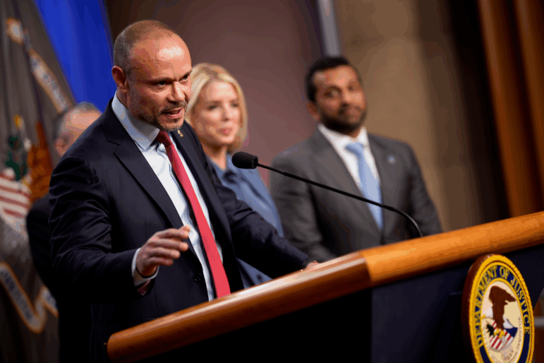 FBI Deputy Director Dan Bongino speaks during a news conference on an arrest of a suspect in the January 6th pipe bomb case at the Department of Justice on Dec. 4, 2025.