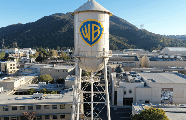 BURBANK, CALIFORNIA - DECEMBER 05: An aerial view of the Warner Bros. logo displayed on the water tower at Warner Bros. Studio on December 5, 2025 in Burbank, California.