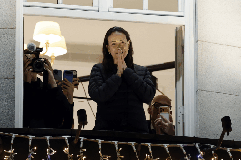 Nobel peace laureate Maria Corina Machado greets supporters from a balcony of the Grand Hotel in Oslo, Norway, in the early hours of Dec 11, 2025.