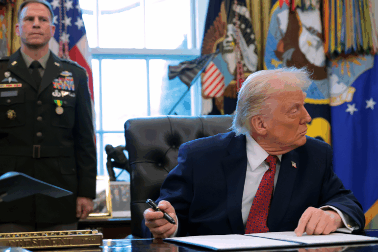 President Donald Trump signs an executive order classifying fentanyl as a "weapon of mass destruction," during a ceremony for the presentation of the Mexican Border Defense Medal in the Oval Office of the White House on December 15, 2025 in Washington, DC. D