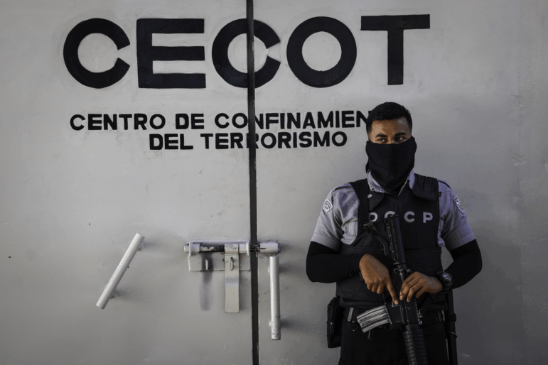 A prison guard mans an interior perimeter at the CECOT (Counter Terrorism Confinement Center) on Dec.15, 2025 in Tecoluca, El Salvador. CECOT gained notoriety in 2025 when the Trump administration began its controversial policy of deporting people to El Salvador who they claimed were members of the Venezuelan gang Tren De Aragua.