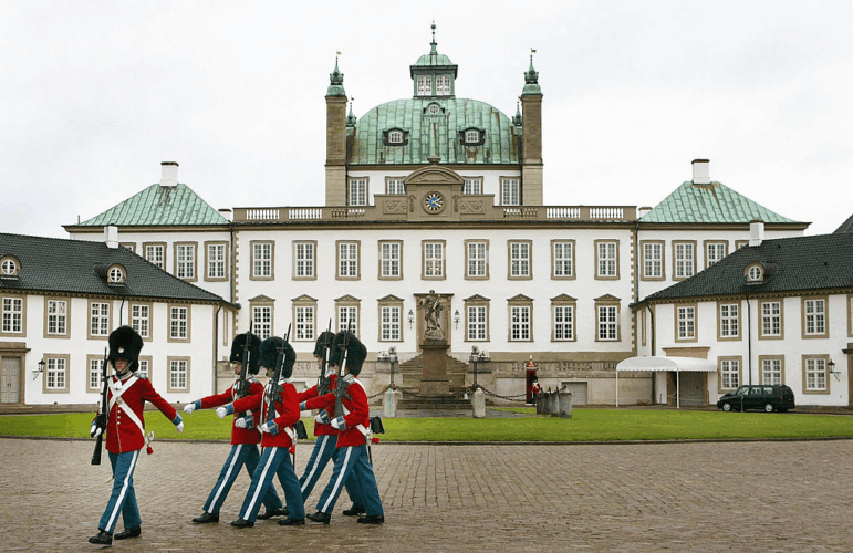 Guards march in the courtyard of Fredensborg Palace in Denmark. The northern European country of around 6 million people has been suggested as a model for U.S. childhood vaccination policy.