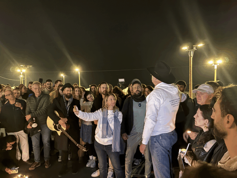 Australian Jews and others hold a vigil in Tel Aviv for the victims of the Bondi beach massacre, on Sunday, Dec 14.