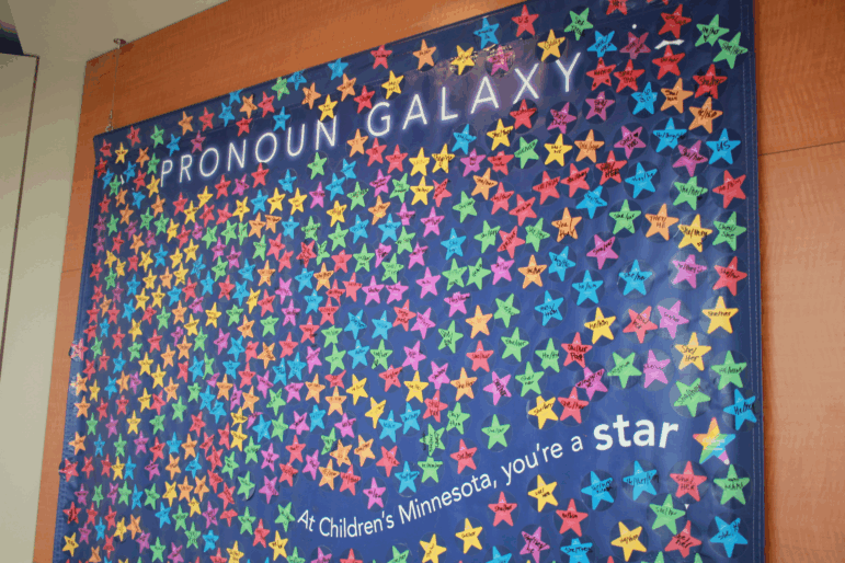 A display at the Gender Health Program of Children's Minnesota hospital says "Pronoun Galaxy" and it has hundreds of stars representing different patients.