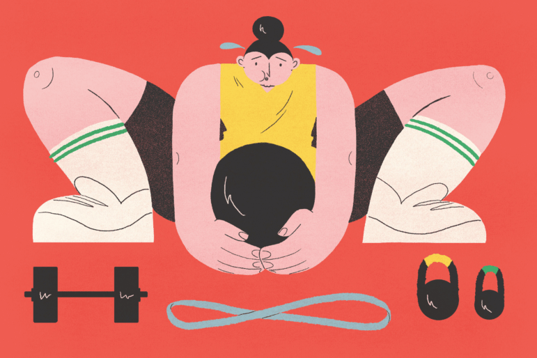 A woman squatting with a heavy weight.