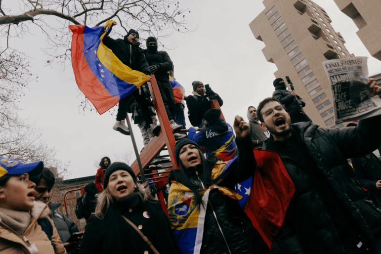 Anti-Maduro demonstrators fly Venezuelan flags outside the federal courthouse in Lower Manhattan, New York, on Monday, January 5.