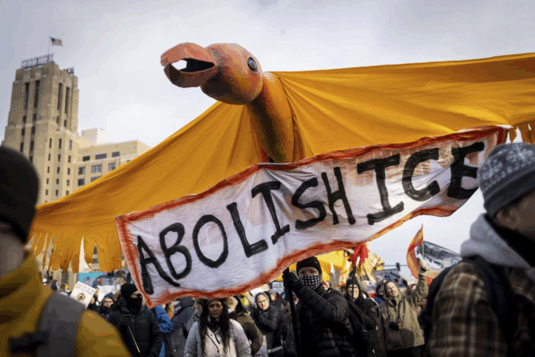 A large bird puppet crafted at In the Heart of the Beast Puppet and Mask Theatre in Minneapolis is carried down Lake Street during a march demanding ICE’s removal from Minnesota on Saturday, Jan. 10, 2026.