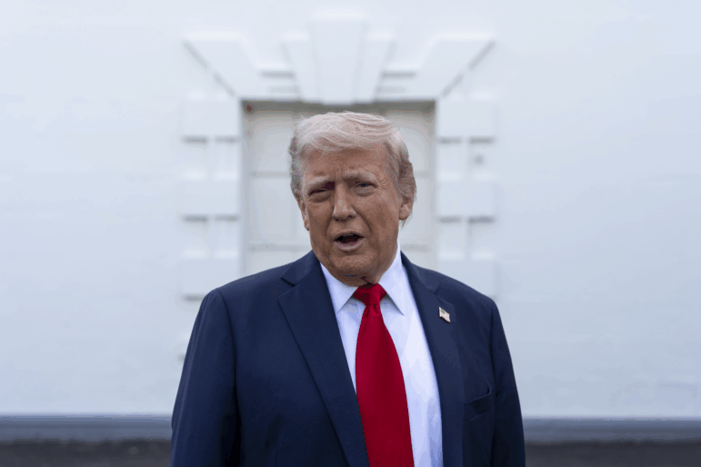 President Donald Trump speaks with reporters at the White House on Wednesday in Washington. (AP Photo/Alex Brandon)