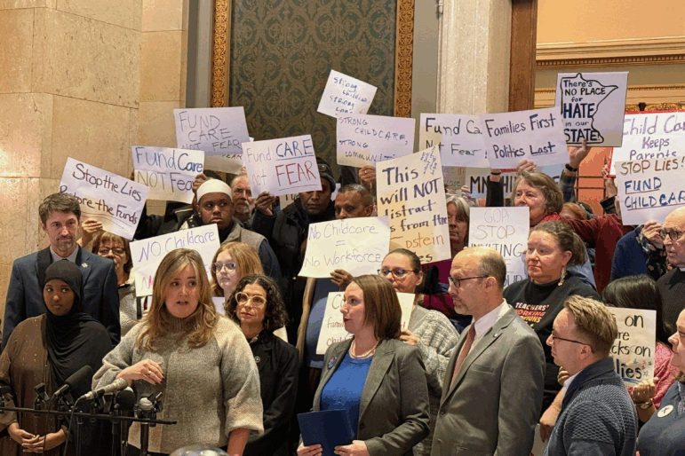 Child care advocates speak at a news conference last month in the Minnesota state capitol building in St. Paul.