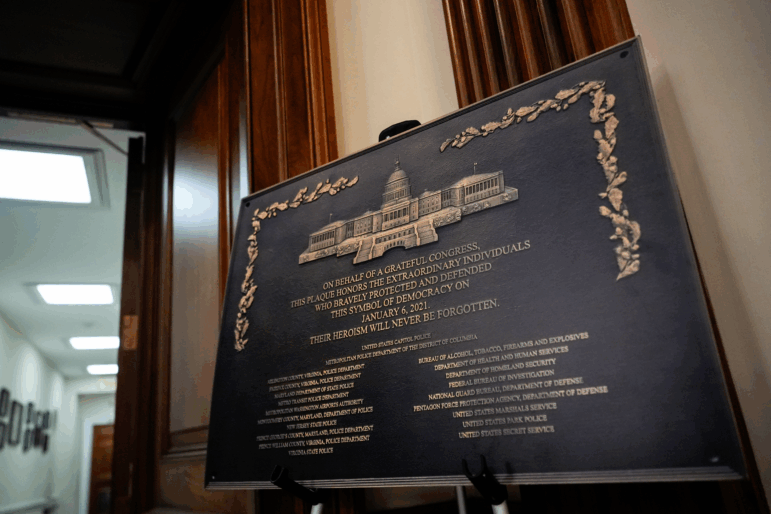 A replica plaque commemorating the Jan. 6, 2021 Capitol riot stands outside the office of House Minority Leader Hakeem Jeffries, D-N.Y, Tuesday, Dec. 30, 2025, at the U.S. Capitol in Washington.