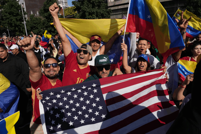 Venezuelans celebrate after U.S. President Donald Trump announced that Venezuelan President Nicolas Maduro had been captured and flown out of the country in Santiago, Chile, Saturday.