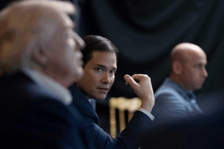 In this photo released by the White House, President Donald Trump monitors U.S. military operations in Venezuela, with Secretary of State Marco Rubio and White House deputy chief of staff Stephen Miller at Mar-a-Lago in Palm Beach, Fla., Saturday, Jan. 3, 2026. (Molly Riley/The White House via AP)