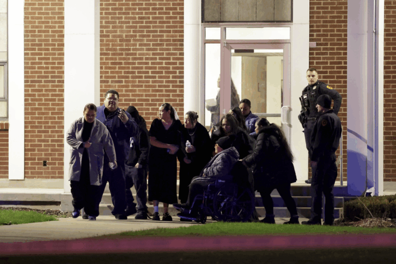People attending a funeral at the The Church of Jesus Christ of Latter-day Saints in Salt Lake City leave after a fatal shooting in the parking lot Wednesday, Jan. 7, 2025.