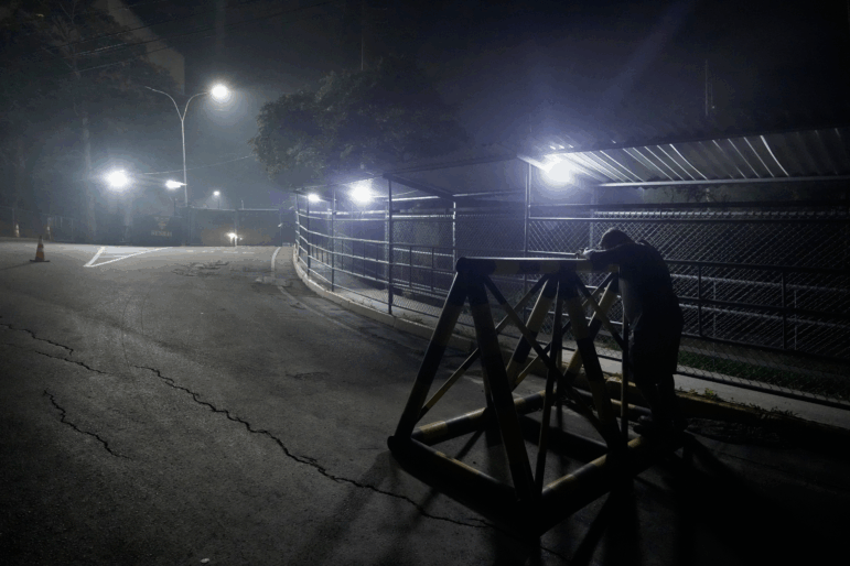 A relative of a political prisoner waits outside the Rodeo I prison in Guatire, Venezuela, Thursday, Jan. 8, 2026, after National Assembly President Jorge Rodriguez said the government would release Venezuelan and foreign prisoners.
