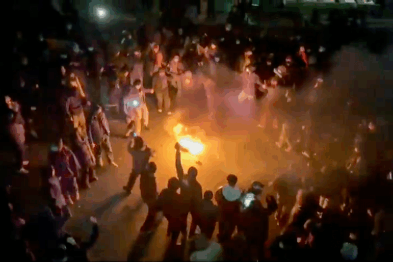 In this frame grab from footage circulating on social media shows protesters dancing and cheering around a bonfire as they take to the streets despite an intensifying crackdown as the Islamic Republic remains cut off from the rest of the world, in Tehran, Iran, Friday, Jan. 9, 2026.