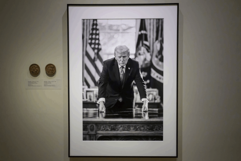 A photograph of President Trump and a short plaque next to it are on display at the Smithsonian's National Portrait Gallery's "American Presidents" exhibit on Sunday.
