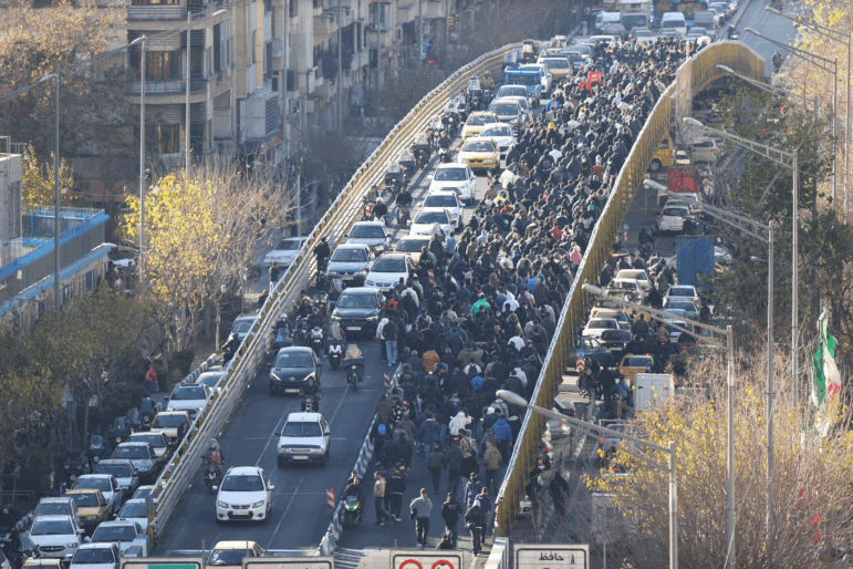 Protesters march on a bridge in Tehran, Iran, on Dec. 29, 2025.