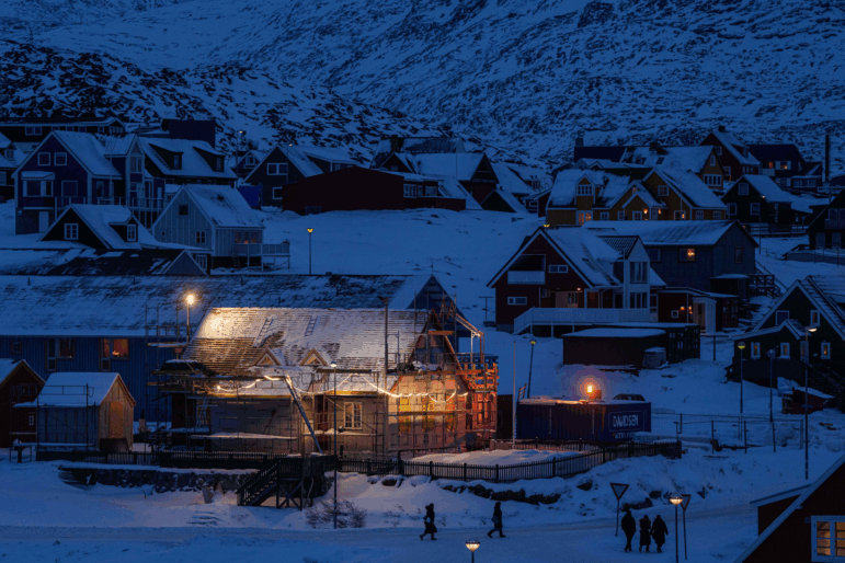 People walk along a street in downtown of Nuuk, Greenland, on Tuesday, Jan. 13, 2026.