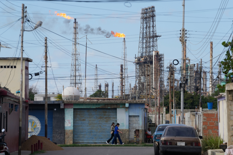 Flames rise from flare stacks at the Amuay refinery in Los Taques, Venezuela, Wednesday, Jan. 14, 2026.